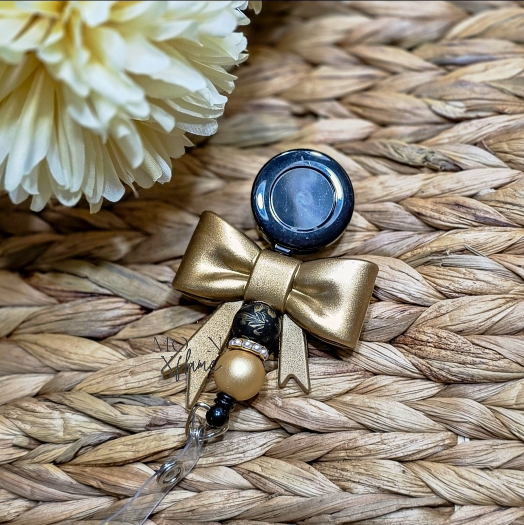Gold Bow Badge Reel