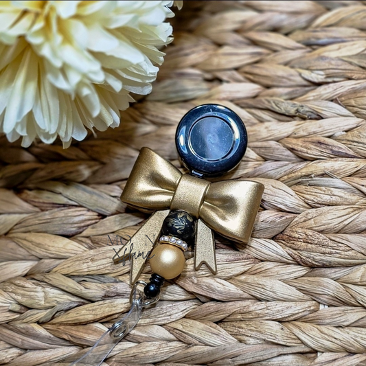 Gold Bow Badge Reel