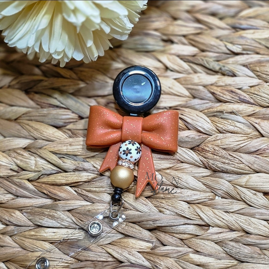 Rust Fall Bow Badge Reel